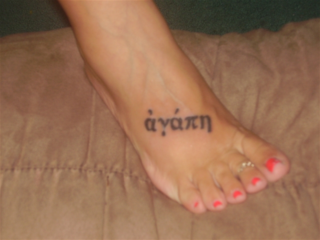And on her right foot is the greek word agape which represents the purest 